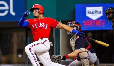 Oct 1, 2021; Arlington, Texas, USA;  Texas Rangers third baseman Andy Ibanez (77) hits an rbi double during the second inning against the Cleveland Indians at Globe Life Field. Mandatory Credit: Kevin Jairaj-USA TODAY Sports