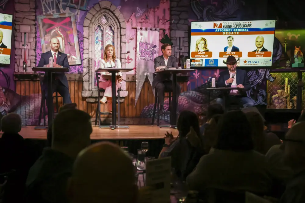 From left, Aaron Reitz, Joan Huffman and Mayes Middleton listen to the moderator read out a question during the attorney general debate Wednesday, Feb. 4, 2026, in Plano.