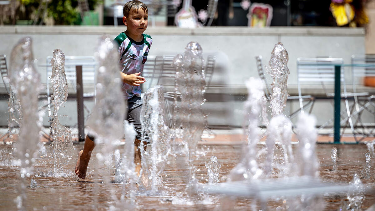 Romero Galindo, 6, runs through a splashpad at Sundance Square in Fort Worth on July 20, 2026. Romero Galindo, 6, runs through a splashpad at Sundance Square in Fort Worth on July 20, 2026.