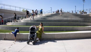 Lani Boudreaux, an Oak Cliff resident, sits on the amphitheater steps at Halperin Park for the opening celebration of Oak Cliff’s new deck park in Dallas, Saturday, May 9, 2026.
