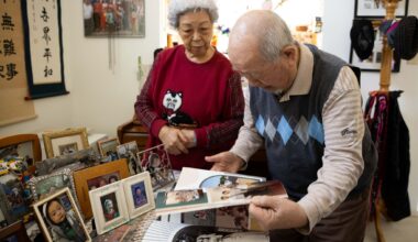 Charles Park, a Korean American community leader and elder, and Susie Aeja Park look through a photo book at their home in Garland, Friday, Jan. 30, 2026.
