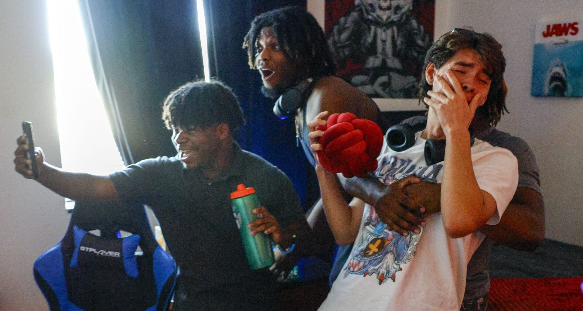 Freshman Dane Benge (right) falls into his friends arms as he sees a Funko figure of himself in his newly decorated dorm room at the University of North Texas on Monday, Aug. 3, 2026, in Denton.