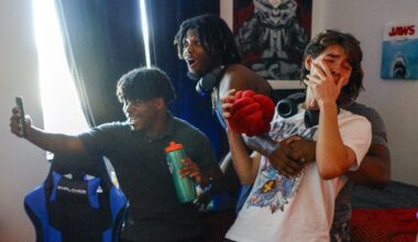 Freshman Dane Benge (right) falls into his friends arms as he sees a Funko figure of himself in his newly decorated dorm room at the University of North Texas on Monday, Aug. 3, 2026, in Denton.