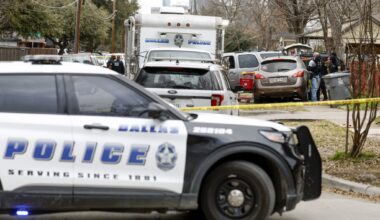 Dallas police work the scene of an officer-involved shooting near Shaw Street and North Winnetka Avenue, Friday, Feb. 20, 2026, in Dallas. Dallas police Chief Daniel Comeaux said police shot and killed a suspect Friday while serving a warrant.