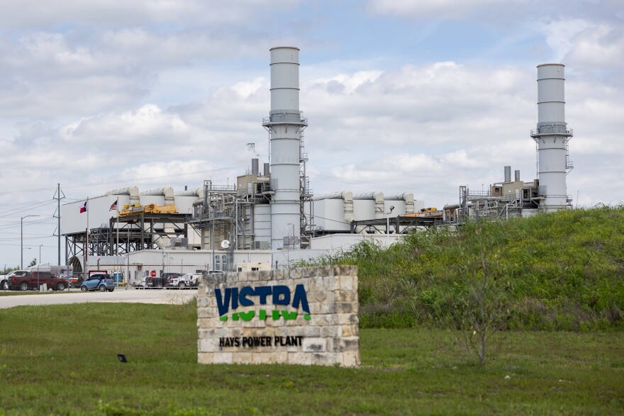 A power plant with a sign reading Vistra Hays Power Plant.