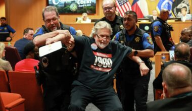 Former Texas lawmaker Lon Burnam was carried out of the Tarrant County Commissioners meeting on Aug. 4, 2026, at the request of County Judge Tim O'Hare.