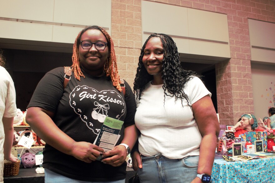 Ashleigh Fedderman (left) and her mother Shenita Fedderman (right) arrive to get resources for a family member.