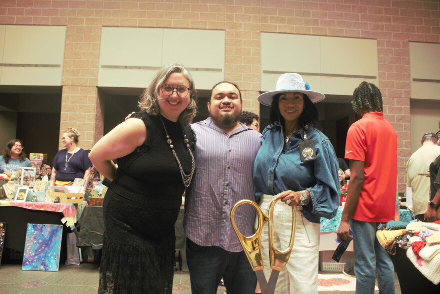 Neurospicy SA board chair, Heaven Handley, Secretary Fabian Cantu, and Bexar County Clerk Lucy Adame-Clark pose at the ribbon-cutting ceremony.