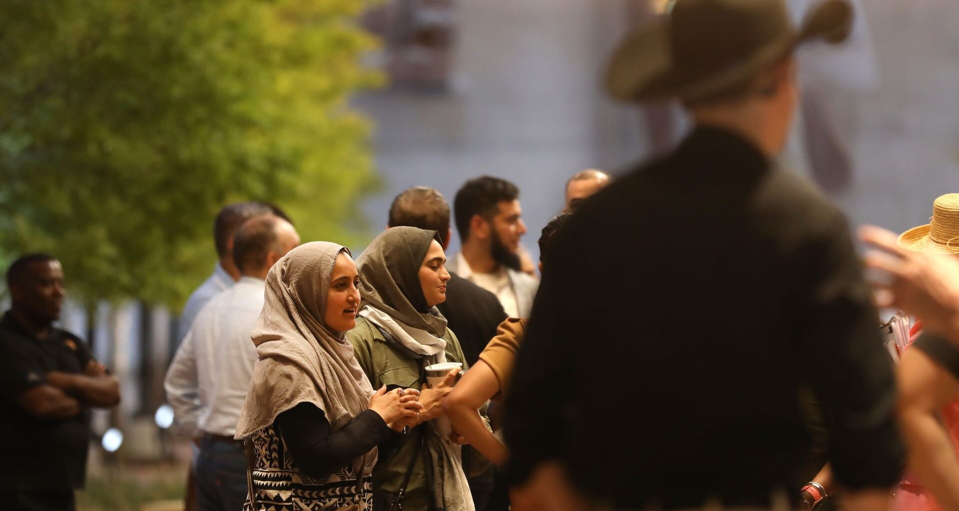 People gather outside a city council meeting at City Hall in McKinney, Texas, Tuesday evening, August 4, 2026. The council was voting on the site plan for a mosque submitted by the McKinney Islamic Association.