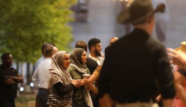 People gather outside a city council meeting at City Hall in McKinney, Texas, Tuesday evening, August 4, 2026. The council was voting on the site plan for a mosque submitted by the McKinney Islamic Association.