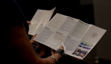 Residents peruse through printed material outlining the process of constructing the '26-27 City of Dallas budget which is estimated to be near $5 billion during a called meeting to increase awareness. The townhall meeting, sponsored and conducted by City of Dallas District 11 Council member Bill Roth, was held at Fretz Park Branch Library in Dallas on March 26, 2026.