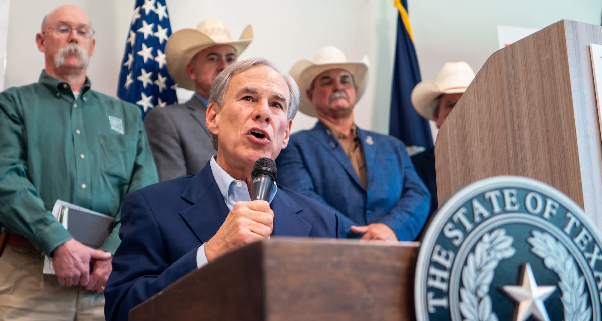 Texas Gov. Greg Abbott speaking at a podium.
