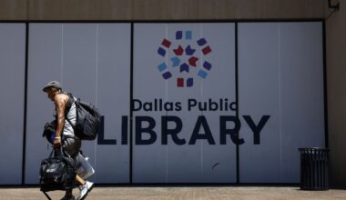A man heads for the front door of the closed J. Erik Jonsson Central Library, July 10, 2026, after the city decided to furlough employees to save money. He found the doors locked and a sign informing him of the furlough.