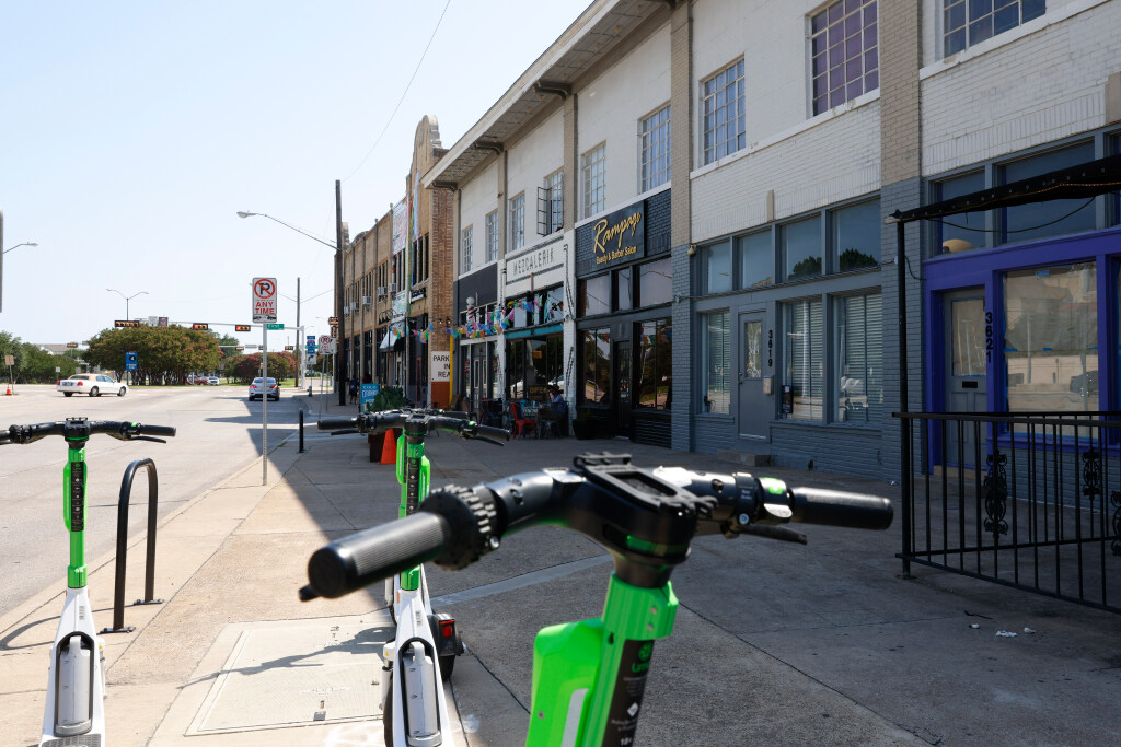 Lime scooters are seen in front of properties across Fair Park along Parry Ave. on Saturday, June 24, 2023.