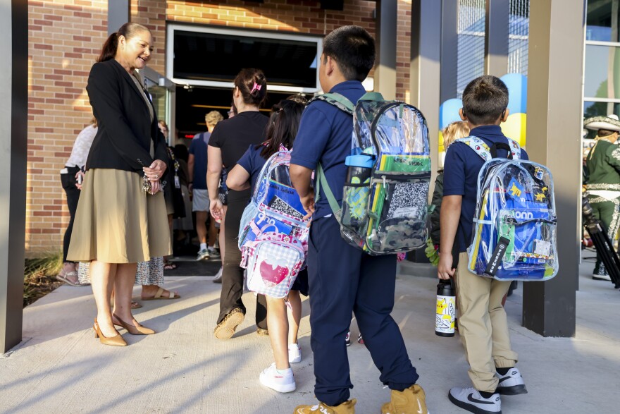 Principal Melinda Smith greets students on the first day of school Tuesday, Aug. 11, 2026, at Victor Hexter Elementary School in Dallas.