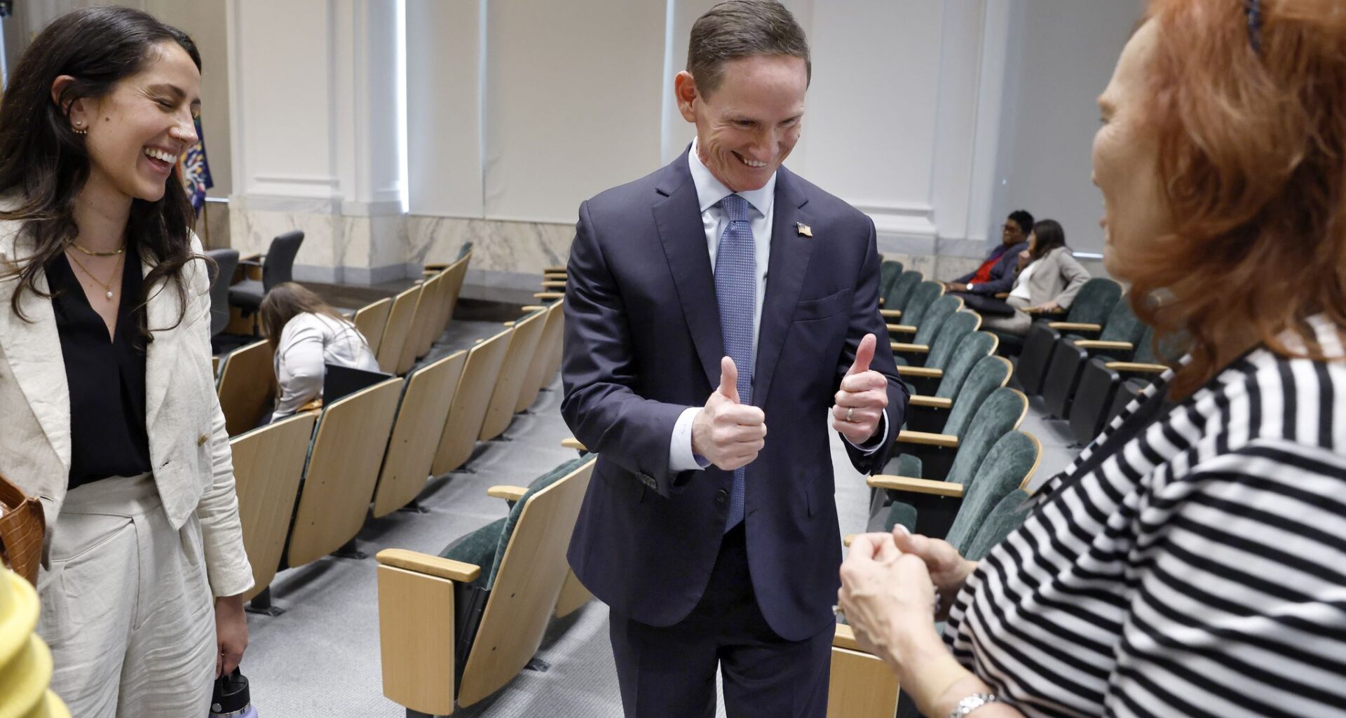 Dallas County Judge Clay Jenkins gives a thumbs up to Brenda Snitzer Executive Director of The Stewpot (right) as he met with she and Housing Forward’s Rachel Wilson at Dallas County Commissioners Court, August 11, 2026. Commissioners voted to put a higher tax to pay for homeless services on the November ballot.