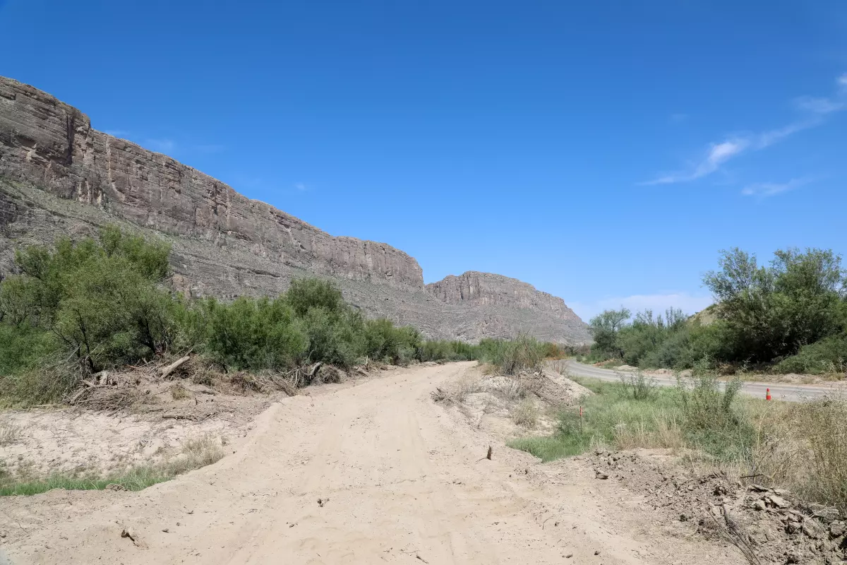Federal contractors have cleared a portion of land next to an existing paved road in Big Bend National Park in recent days.