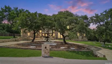 This hilltop mansion for sale in San Antonio has a secret grotto that lets you swim into an interior living area