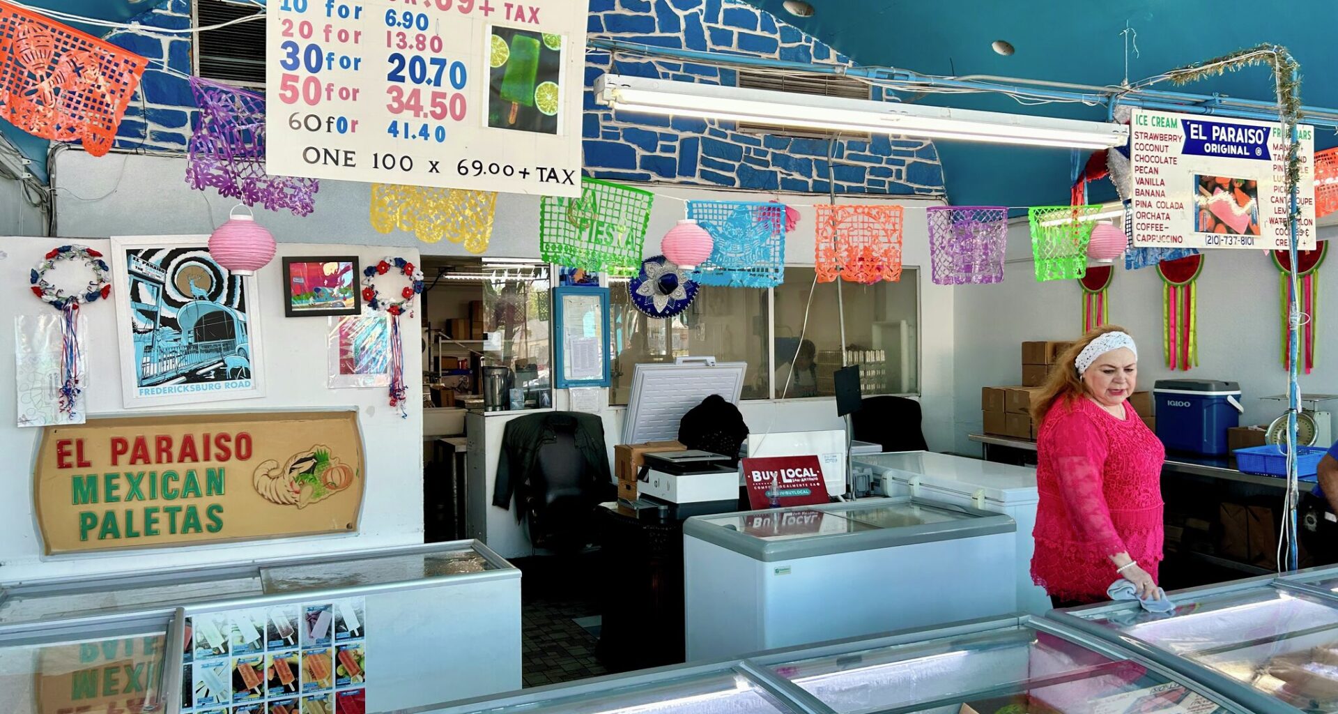 El Paraiso owner Maria Flores takes note of inventory at her Fredericksburg Road shop. 