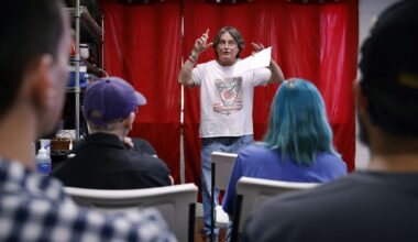 Jo Hargis of the DFW Anti-War Committee (right) listens to a speaker at an event Friday hosted by the Dallas Against the Trump Agenda Coalition, a group plannning a series of protests at the Republican midterm convention in Dallas.