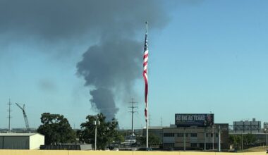 A large smoke plume is seen as a grass fire burns near Dallas' Red Bird and Mountain Creek areas on August 16, 2026.