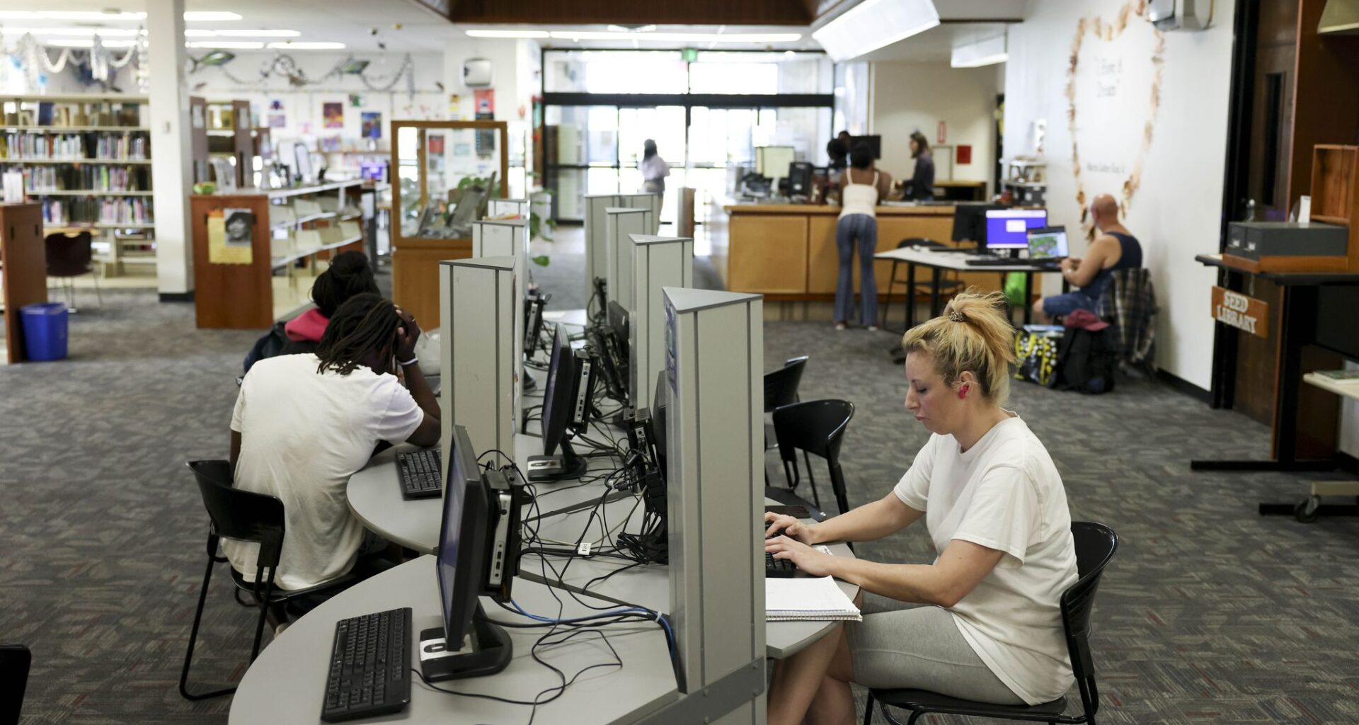 People work at the computer station in the Martin Luther King Jr. Branch Library, on Thursday, March 5, 2026 in Dallas.