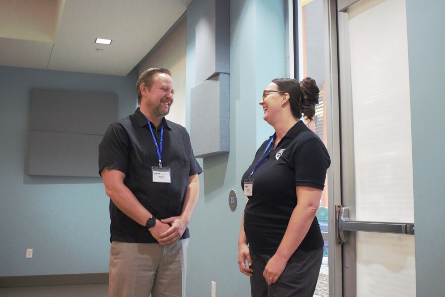 Employ210’s project director is John Davis speaks with Ashley Labay, a Clinical Associate Professor of Educational Psychology in the Behavior Analysis program at UT San Antonio, before the disability forum begins.