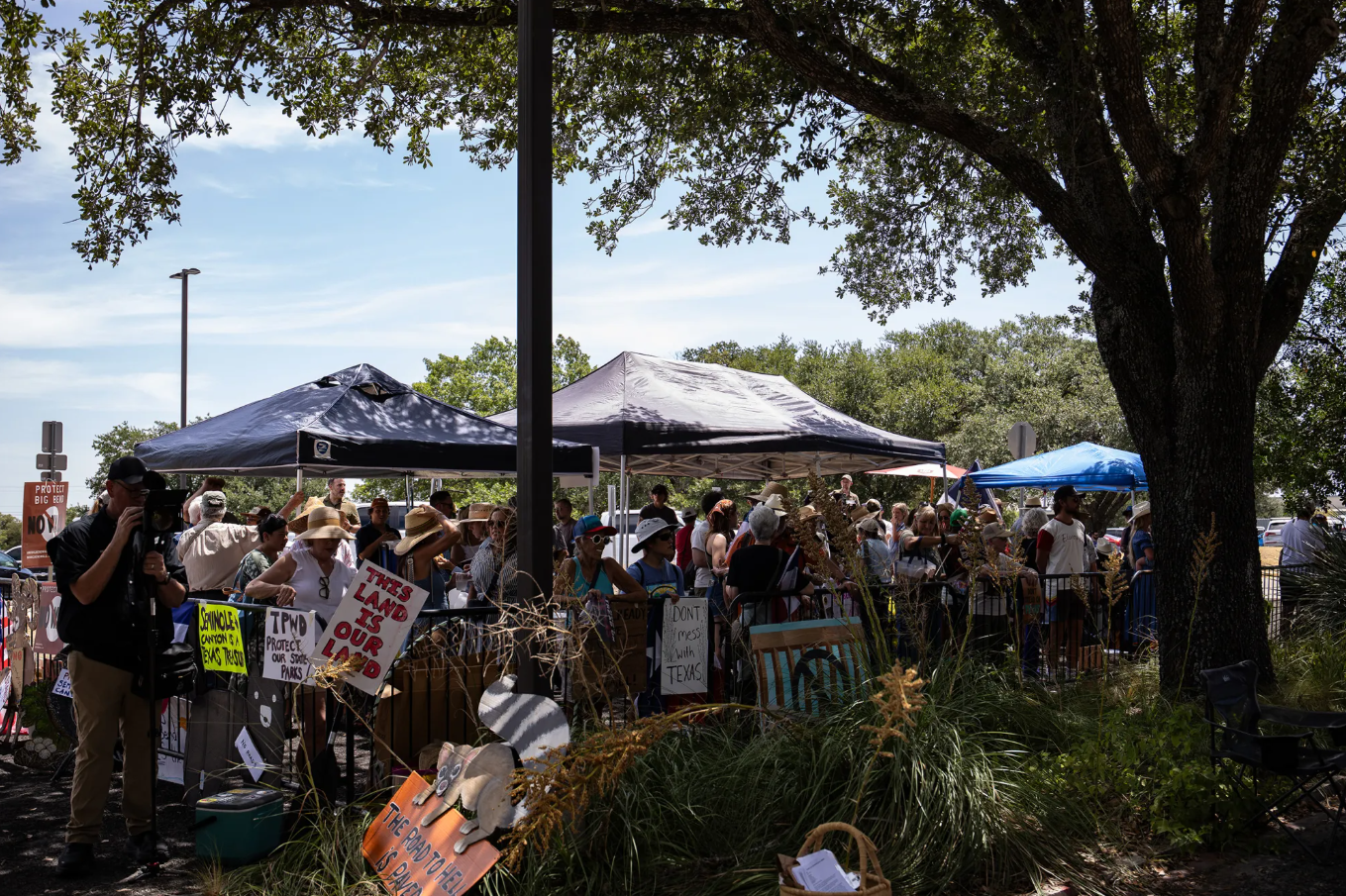 Dozens gather in opposition of border infrastructure projects in the Big Bend region before the Texas Parks and Wildlife Commission's public meeting in Austin on Aug. 18, 2026.