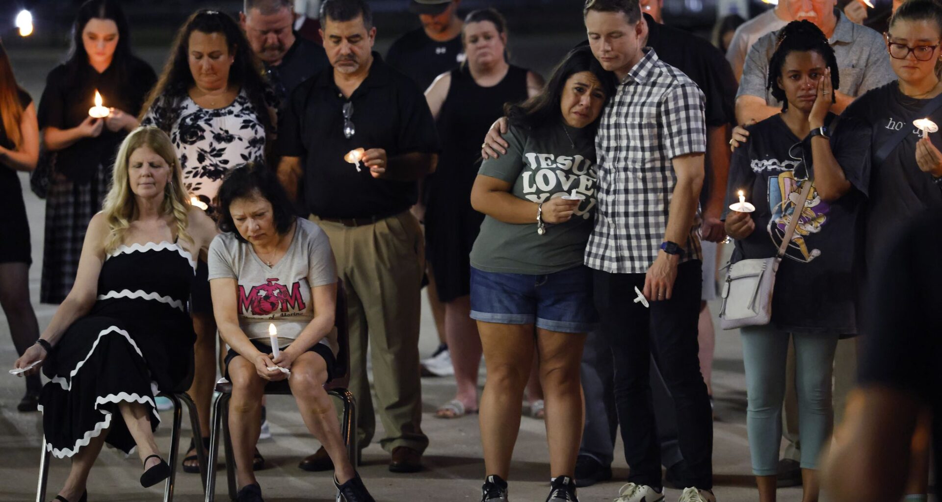 Friends and family of Marine Pvt. Aiden Craig, including his mother Lisa Craig (seated, second from left) came together at Wylie High School for a candlelight vigil  August 21, 2026. Craig died during a physical training evaluation at Camp Pendleton.