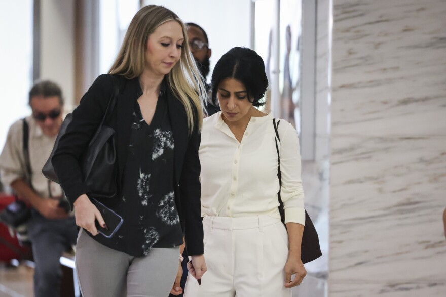 Nausheen Gilkar, genetic mother, walks back to the courtroom after a break during a hearing regarding a temporary restraining order against surrogate McKenna West Tuesday, Aug. 25, 2026, in Dallas.