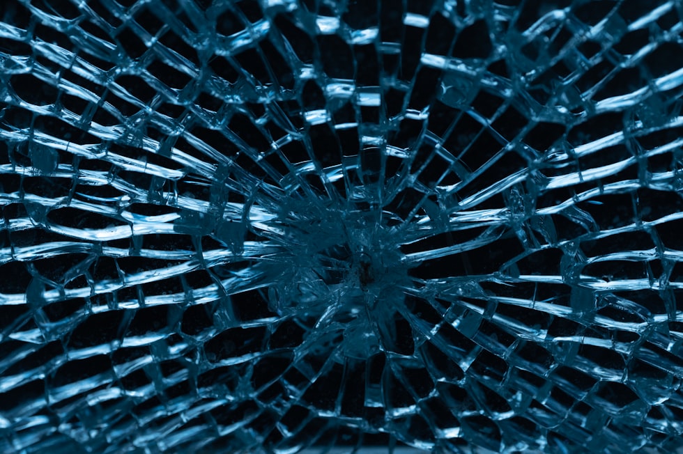 a close up of a broken glass window