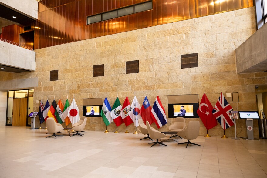 The flags serve as a reminder that while each city is different, in many ways they are alike. Patricia Lim/KUT News