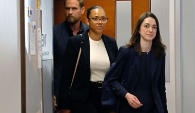McKenna West, center, comes out of a courtroom with her legal team after a hearing regarding her baby surrogacy case on Tuesday, Aug. 25, 2026, in Dallas.