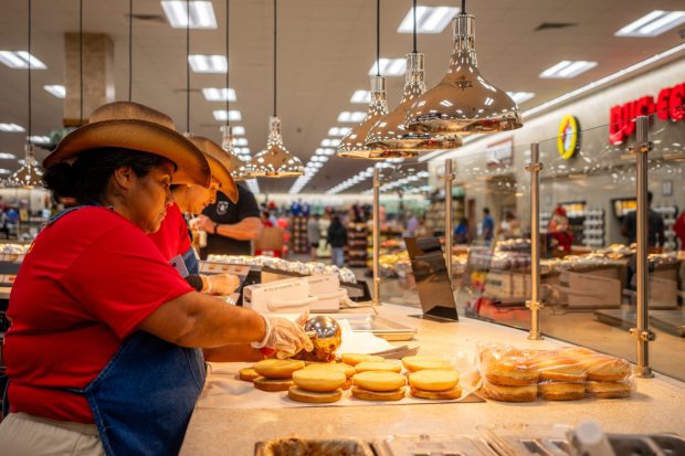 LULING, TEXAS - JUNE 12: Employees prepare food inside of the Buc-ee's convenience store on June 12, 2024 in Luling, Texas. The Texas-based convenience store and gas stop, Buc-ee's has become the world's largest convenience store with over 100 gas pumps and a 75,000 square feet store. The newly opened location in Luling is nearly 30 times larger than average convenience stores, and hosts thousands of food and beverage options. (Photo by Brandon Bell/Getty Images)