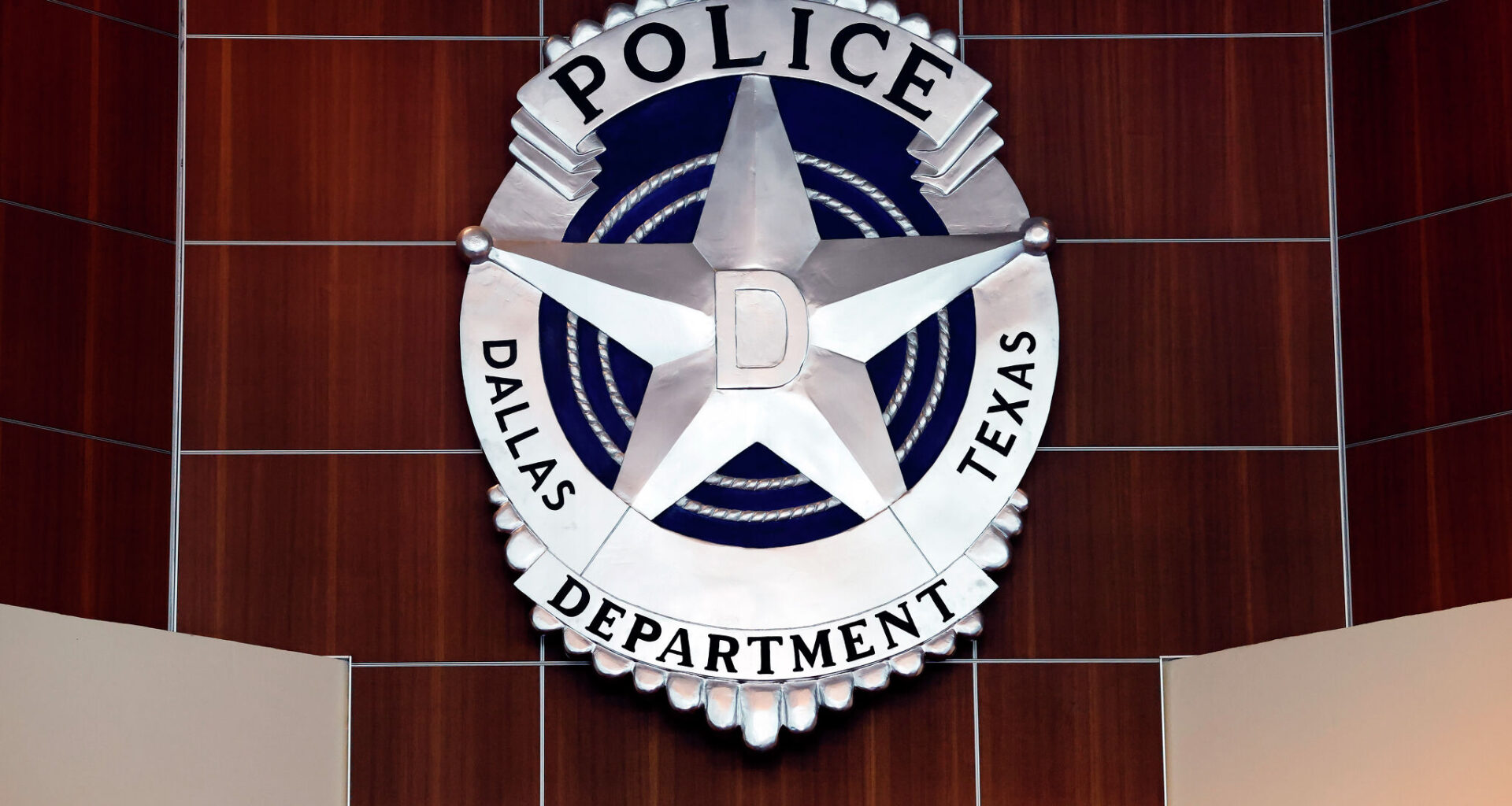 Dallas Police say a sports car struck an SUV, a parked vehicle and a tree in downtown Dallas, sending four people to a hospital. Police arrested the driver on a DWI charge.