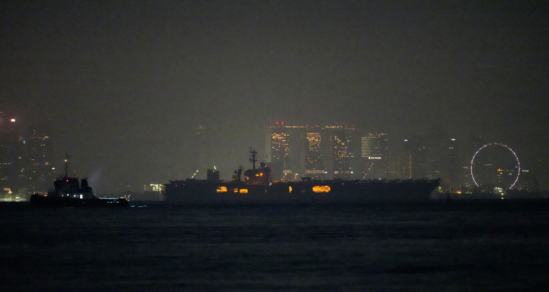 USS Abraham Lincoln sails past Singapore on its way home from Middle East