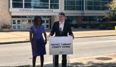 Talarico stands at a podium outside the Maverick Activities Center in Arlington, joined by County Commissioner Alisa Simmons.