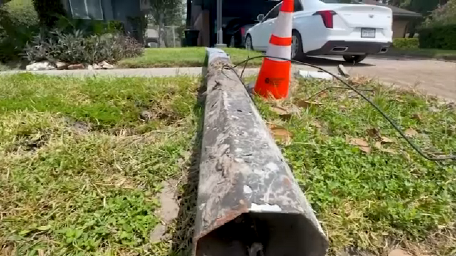 Action 13: Light pole knocked down onto NE Houston yard during crash picked up by CenterPoint a week later