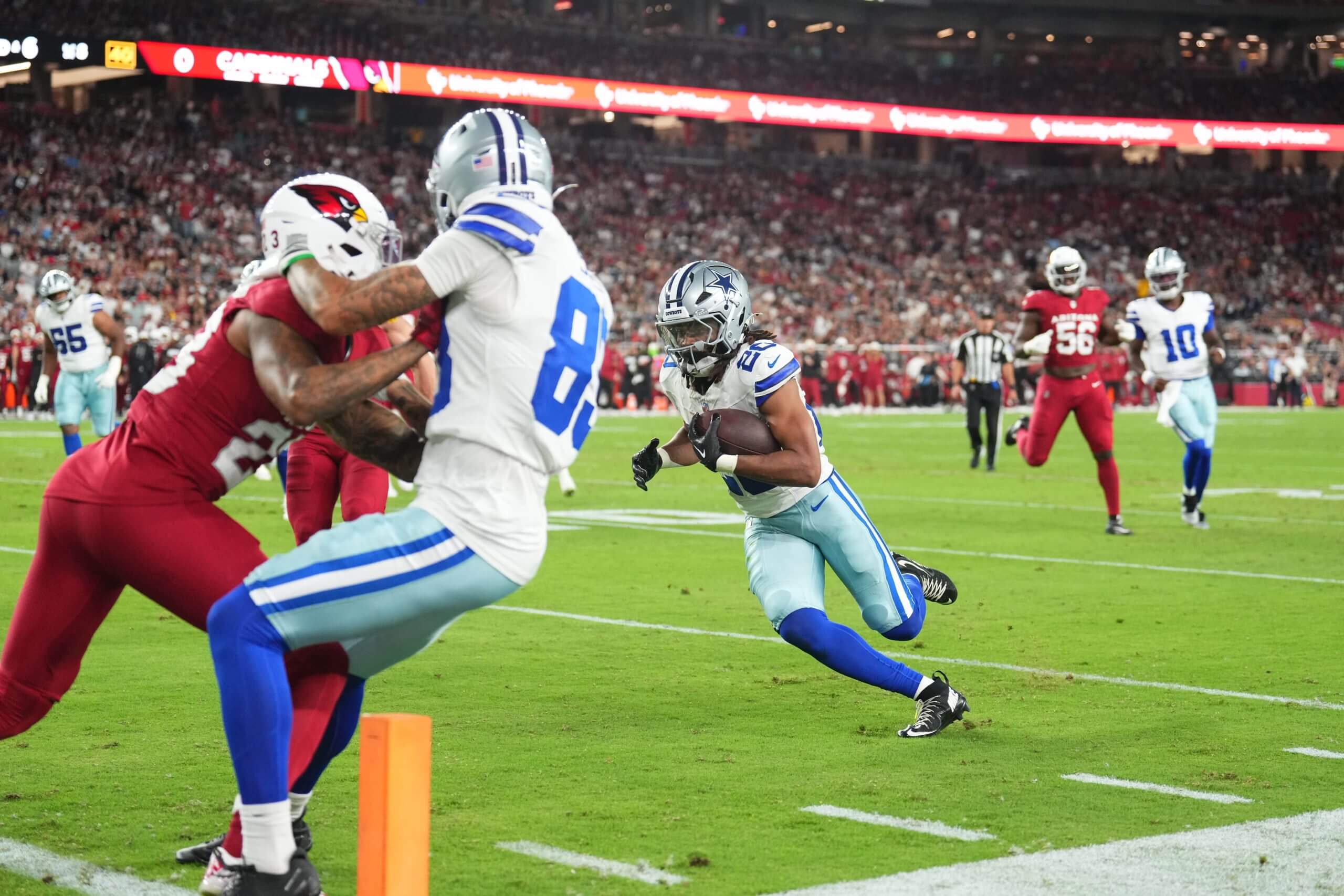 Dallas Cowboys running back Malik Davis (20) scores for a touchdown against the Arizona Cardinals during the first half at State Farm Stadium. 