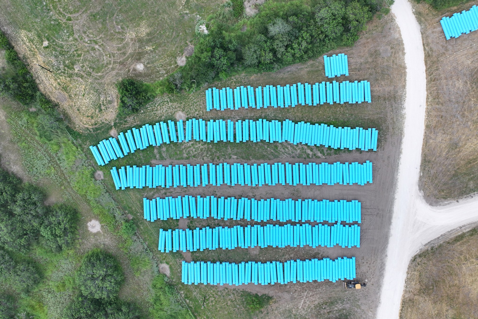Rows of pipe line an open field in the City of Corpus Christi's Western Ground Water Well Field Monday, July 13, 2026.