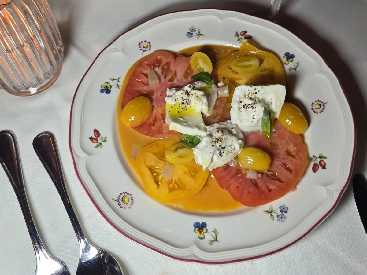 The seasonal heirloom tomato salad now available at State of Grace. Photo by Mario-Sebastian Berry.