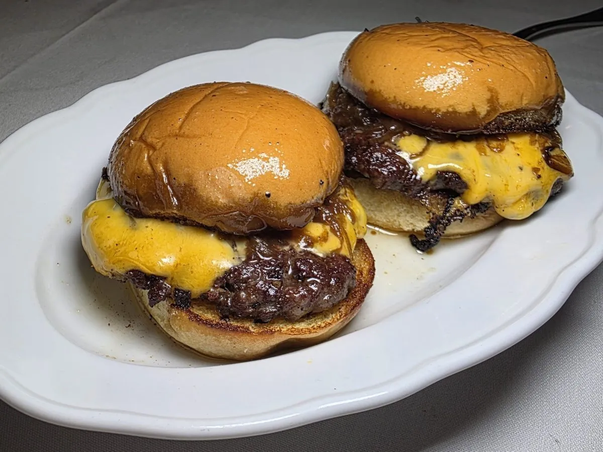Executive chef Ryan Lachaine's Butter Burgers taste even better than I remember them being at Riel. Just look at that line on those buns from the soaked butter! Photo by Mario-Sebastian Berry.
