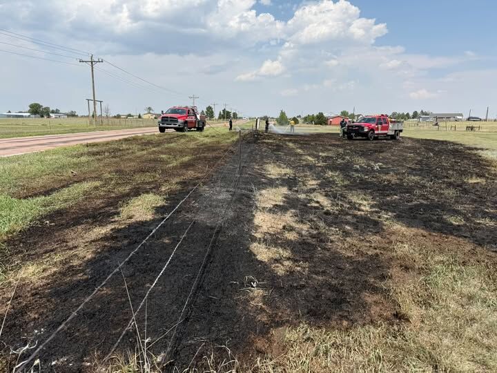 Crews mop up a grass fire near the North Ellicott Highway in El Paso County on Monday, Aug. 10, 2026. (Courtesy of the Peyton Fire Protection District)