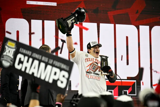 Dec 6, 2025; Arlington, TX, USA; Texas Tech Red Raiders linebacker Ben Roberts (13) celebrates after the win against the BYU Cougars at AT & T Stadium. Mandatory Credit: Jerome Miron-Imagn Images