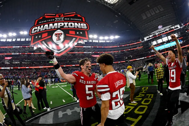 Dec 6, 2025; Arlington, TX, USA; Texas Tech Red Raiders wide receiver Caleb Douglas (5) celebrates with defensive back Deante Lindsay (26) after the win against the BYU Cougars at AT & T Stadium. Mandatory Credit: Jerome Miron-Imagn Images