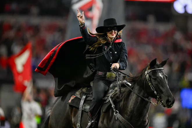 Dec 6, 2025; Arlington, TX, USA; The Texas Tech Red Raiders mascot rides on to the field before the game against the BYU Cougars at AT & T Stadium. Mandatory Credit: Jerome Miron-Imagn Images