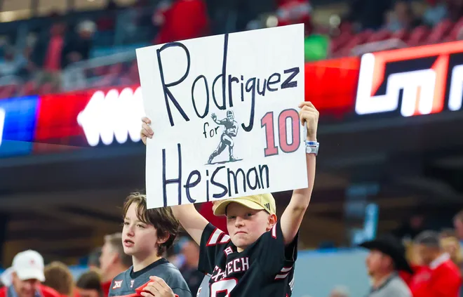 Dec 6, 2025; Arlington, TX, USA; A Texas Tech Red Raiders fan holds up a sign for Texas Tech Red Raiders linebacker Jacob Rodriguez (not pictured) before the game against the BYU Cougars at AT & T Stadium. Mandatory Credit: Kevin Jairaj-Imagn Images