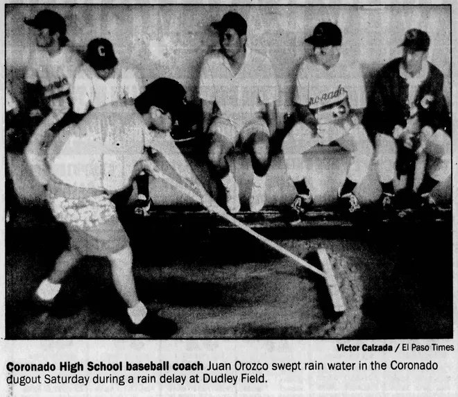 May 24, 1992: Coronado High School baseball coach Juan Orozco swept rain water in the Coronado dugout during a rain delay at Dudley Field.