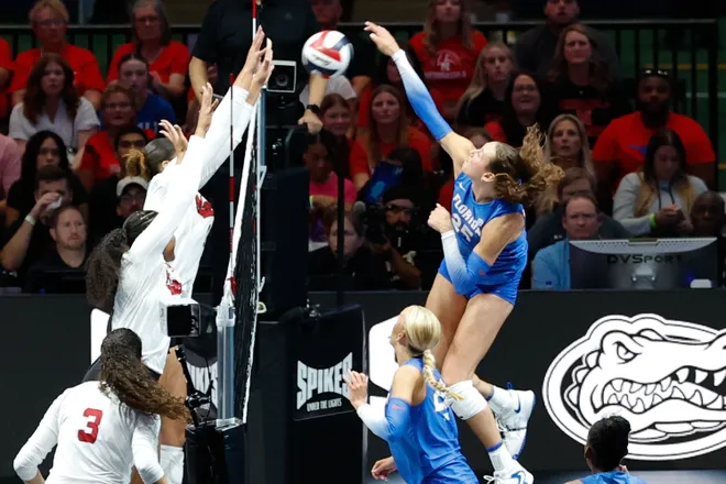 Aug 27, 2026; Arlington, TX, USA; Nebraska Cornhuskers players attempt to block an attack by Florida Gators middle blocker Alec Rothe (25) during their volleyball match at AT & T Stadium. Mandatory Credit: Chris Jones-Imagn Images