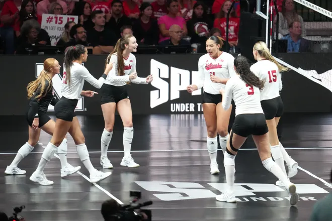 Aug 27, 2026; Arlington, TX, USA; Nebraska Cornhuskers players celebrate a point during their volleyball match against the SMU Mustangs at AT & T Stadium. Mandatory Credit: Chris Jones-Imagn Images